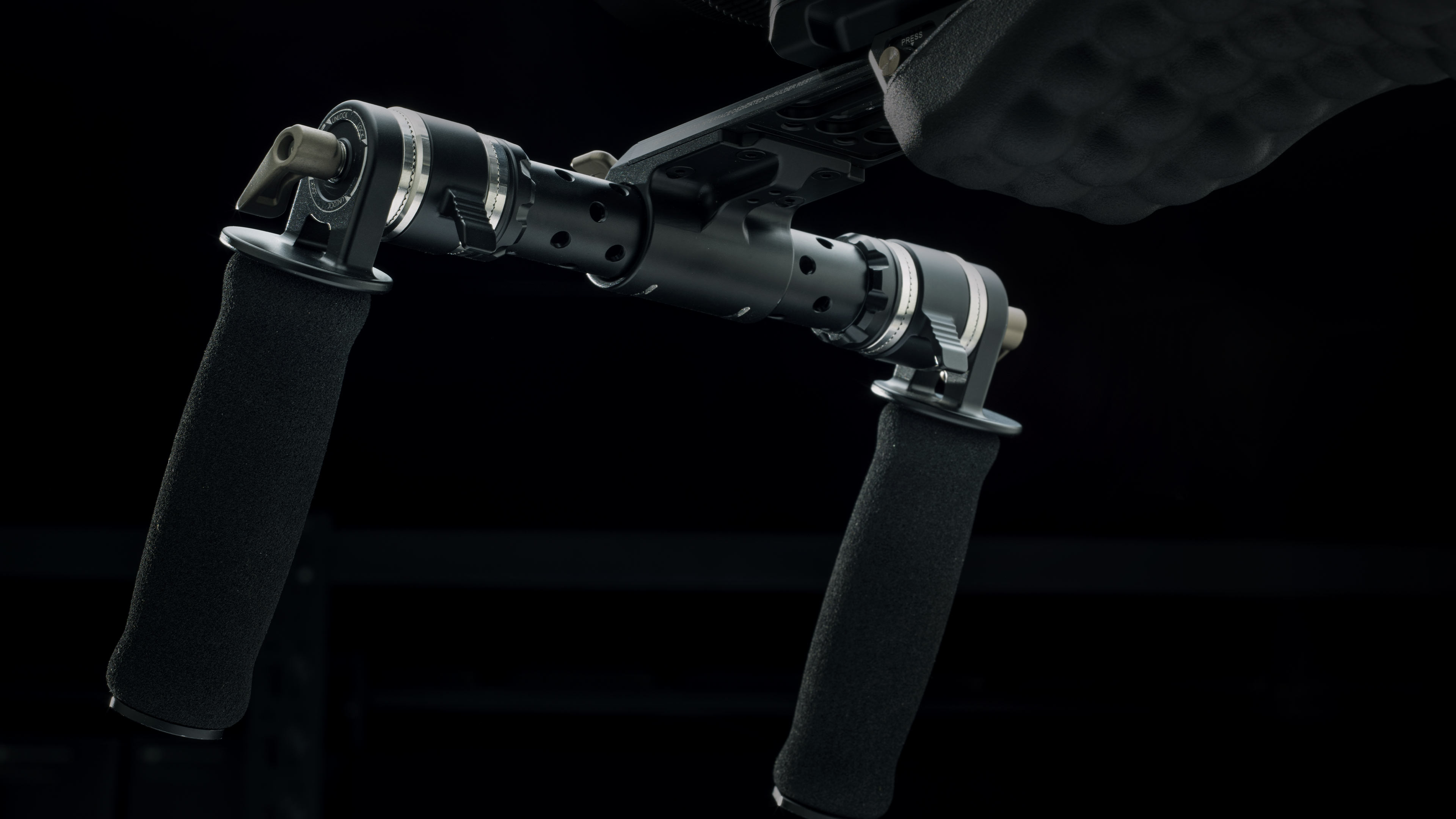 Quick Adjust Rosette Adapter – Black on shoulder rig close up